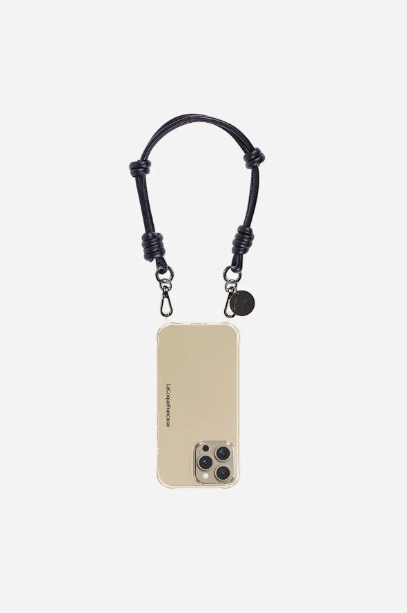 Petra Karthaus black vegan leather knotted wristlet phone lanyard with silver hardware and a small coin charm.